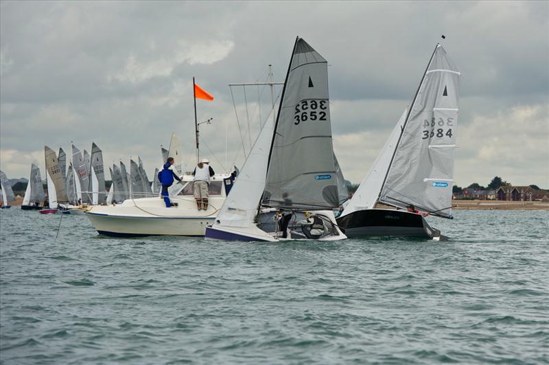 Andy Davis and Tom Pygall match race with Geoff Carveth and Graham Williamson for the Merlin Rocket nationals title photo copyright Chris Bashall / www.rokraider.zenfolio.com taken at Hayling Island Sailing Club and featuring the Merlin Rocket class