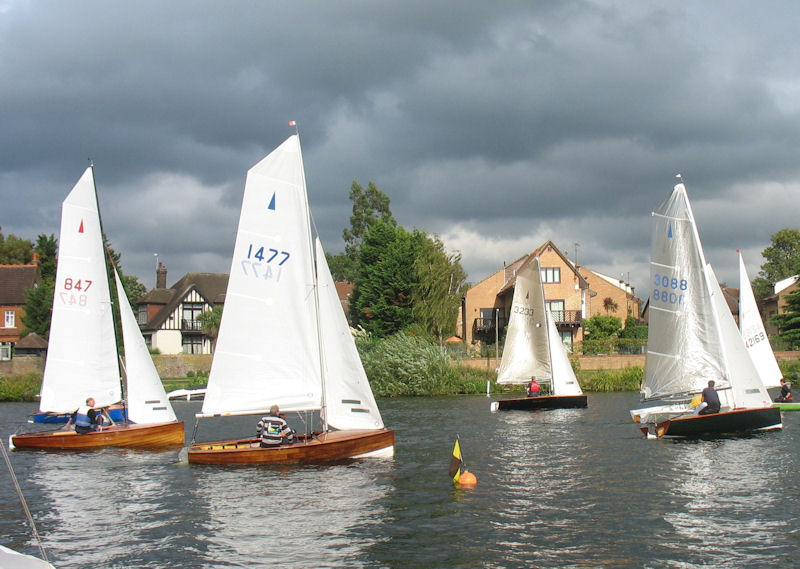 Merlins start under a threatening sky during the Autumn Regatta at Tamesis Club photo copyright John Dunkley taken at Tamesis Club and featuring the Merlin Rocket class