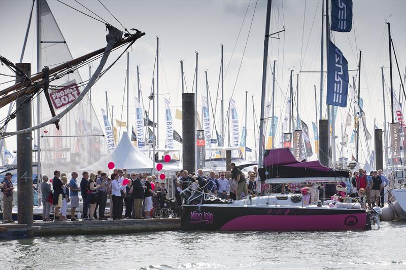 Crowd gathers to welcome Miss Isle photo copyright onEdition taken at  and featuring the Mini Transat class
