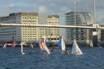 Spectators line the bridge during the London Boat Show pursuit race