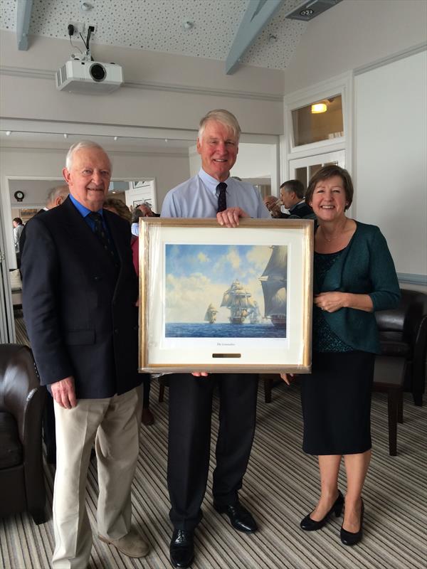 Royal Fowey Yacht Club members presented Dick Doidge Harrison, Commodore, with a framed photo of The Commodore (l to r) Vice-Commodore Col. Geoffrey Simpson, retiring Commodore Mr. Dick Doidge Harrison & Mrs. Carol Hunt, Honorary Secretary (also retiring) photo copyright Lizzie Morgan taken at Royal Fowey Yacht Club
