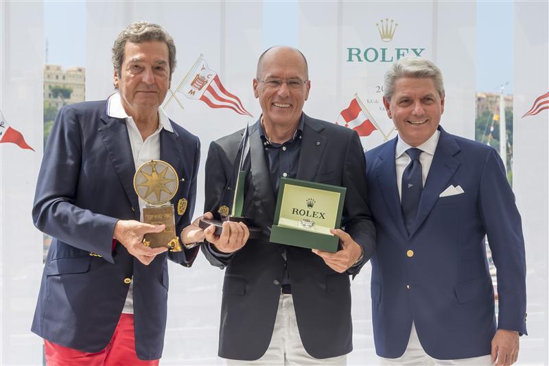Igor Simcic receives a Rolex timepiece and trophy for the 62nd Giraglia Rolex Cup Line Honours victory from Philippe Schaeffer and Gian Riccardo Marini  photo copyright Carlo Borlenghi / Rolex taken at Yacht Club de Monaco