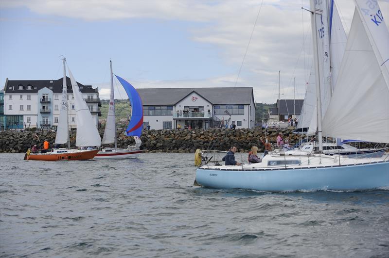 Two of the boats that took part in a sail past on Belfast Lough to celebrate the re-opening of Carrickfergus Sailing Club’s magnificently restored clubhouse - photo © Nigel Thompson
