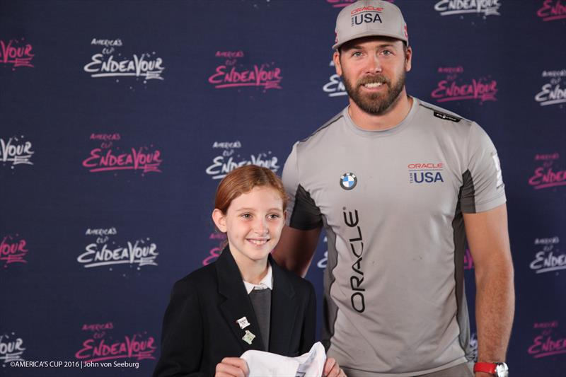 ORACLE TEAM USA sailor Andrew Campbell congratulates Samantha Soares, one of five AC Endeavour graduates to be gifted an Optimist dinghy photo copyright John Von Seeburg / America's Cup taken at 