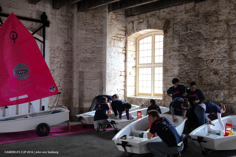 Volunteers put the finishing touches on Optimist dinghies which have been restored by ORACLE TEAM USA and gifted to AC Endeavour graduates photo copyright John Von Seeburg / America's Cup taken at 