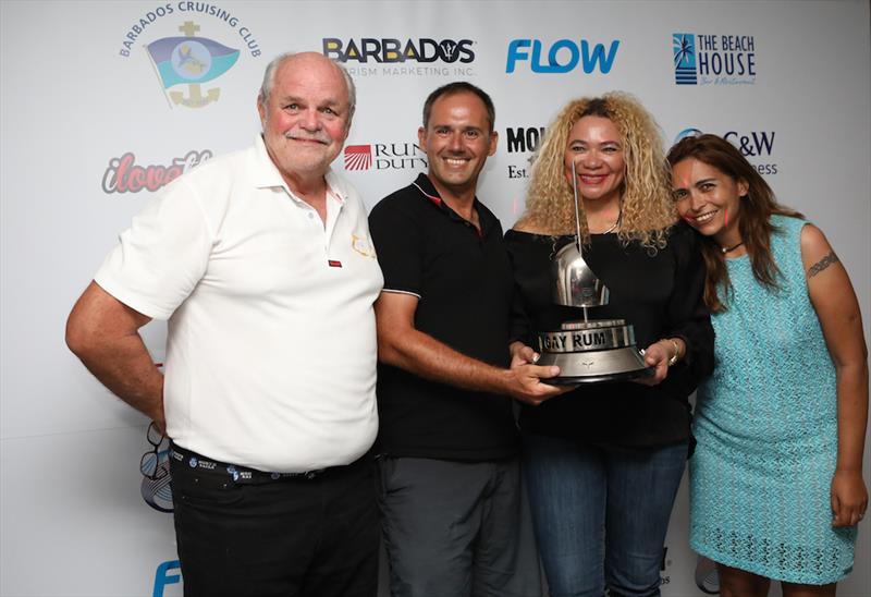 Andreas Berg won 88kg worth of Mount Gay Rum for smashing the Round Barbados Singlehanded record aboard his Dufour 44 – Luna. (from left) Howard Palmer – chairman of the MGRBR committee, Andreas Berg, Petra Roach (BTMI), and Alene Dholakia  – event manage - photo © Nigel Wallace / MGRBR