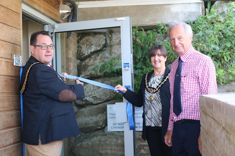 Mayor of Weymouth Richard Kosior and his partner Caroline cut the ribbon to open Castle Cove Sailing Club's upgraded changing rooms1 photo copyright Leah Stroud taken at Castle Cove Sailing Club