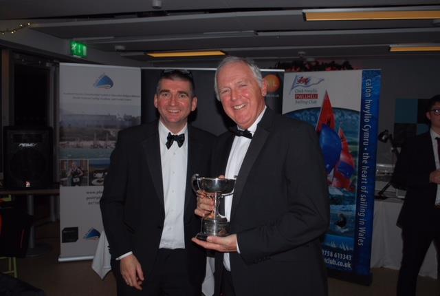 Brian Dixon being awarded the “Merit Trophy” photo copyright Gerallt Williams taken at Pwllheli Sailing Club
