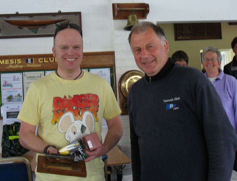 Rob Wilder receives the trophy and packs of tea from Peter Mason after the Great Tea Race at Tamesis photo copyright John Dunkley taken at Tamesis Club