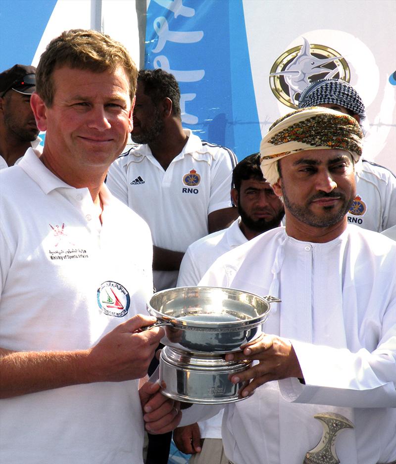 Calum McKie accepting The Chairman's Cup from The Governor of Musandam. His Excellency Sayyid Khalifa bin al Mirdas bin Ahmed al-Busaidi photo copyright Steve Barber / Muscat Regatta taken at 