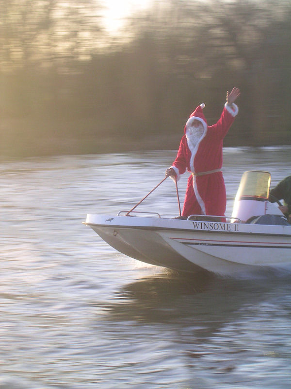 Father Christmas arriving at the Henley Sailing Club last year by speedboat photo copyright Duncan Mackay taken at Henley Sailing Club
