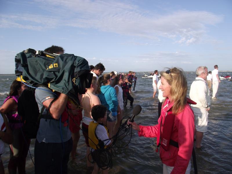 Reporter Sally Simmonds joined the spectator and media throng on the Brambles Bank to report live on this evening's ITV Meridian news photo copyright Phil Riley taken at Royal Southern Yacht Club