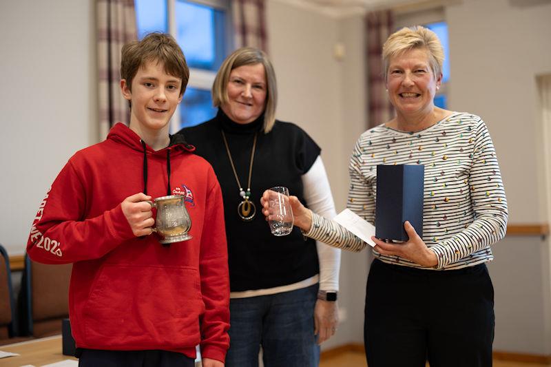 Solway Yacht Club annual Prize Giving: 2023 Cadet Champion, Toby Iglehart, with Jo Harris, Cadet Officer and Liz Train, presenting the prizes photo copyright Nicola McColm taken at Solway Yacht Club