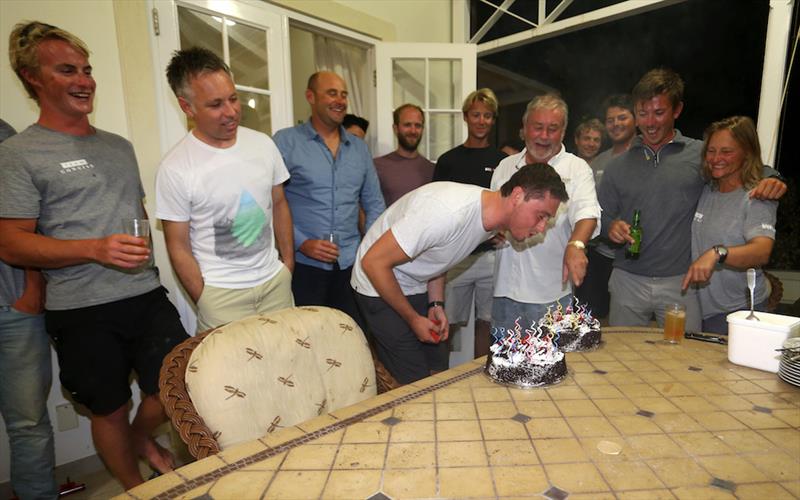 Jackson Boutell blowing out his birthday candles (l-r) John Hamilton, Jonny Malbon, Martin Watts, Rob Gullen, Tom Dawson, Geoff Mearing, Tony Lawson, Wouter Verbraak, Will Semken, Ned Collier Wakefield, Helena Darvelid photo copyright Paul Larsen / Team Concise taken at Barbados Cruising Club and featuring the MOD70 class