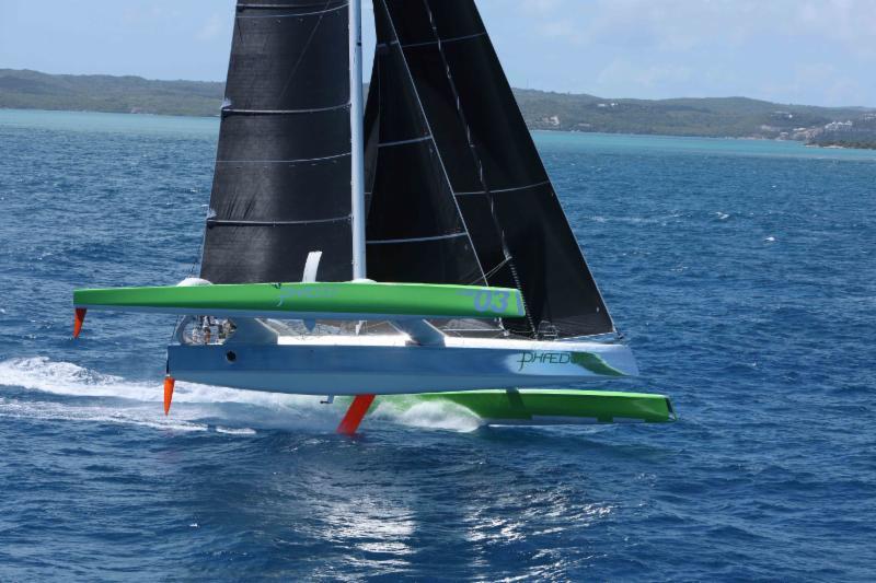 Phaedo3 flying two hulls past Willoughby Bay, Antigua at the start of the RORC Caribbean 600 photo copyright RORC / Tim Wright taken at Antigua Yacht Club and featuring the MOD70 class