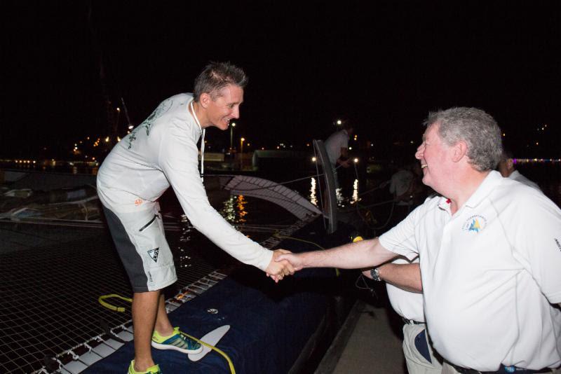 RORC Admiral, Andrew McIrvine greets Team Phaedo on the dock at Camper & Nicholsons Port Louis and welcomes Navigator, Miles Seddon in the RORC Transatlantic Race photo copyright RORC / Arthur Danie taken at  and featuring the MOD70 class