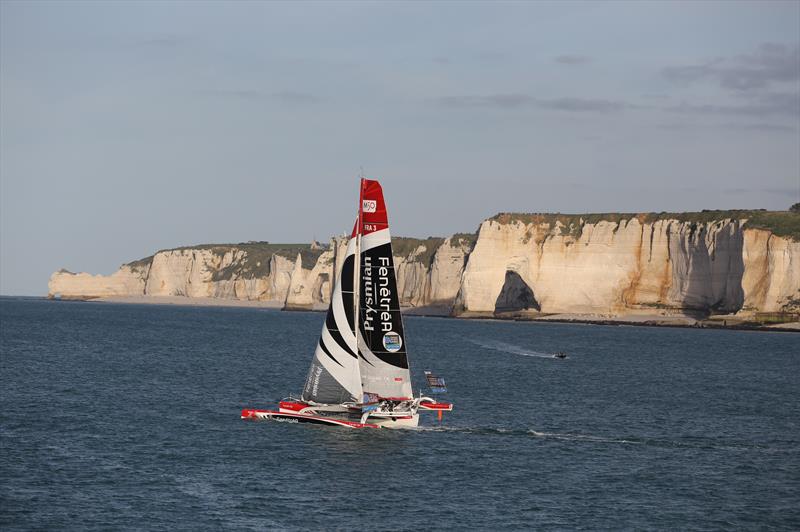 Multi 50 Fenetrea Prysmian, skippered by Erwan Le Roux (FRA) and Giancarlo Pedote (ITA), in front of Etretat cliffs after the start of the 2015 Transat Jacques Vabre photo copyright Jean-Marie Liot / DPPI / TJV2015 taken at  and featuring the Multi 50 class