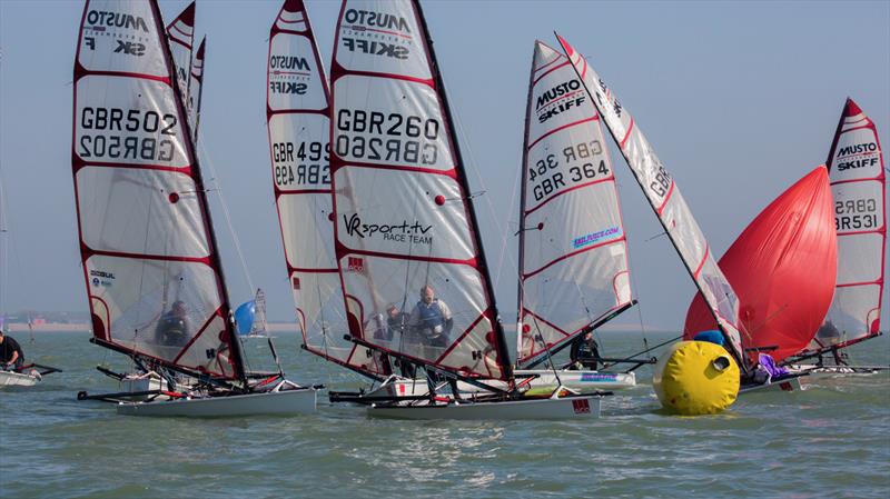 Musto Skiffs at Stokes Bay photo copyright Tim Olin / www.olinphoto.co.uk taken at  and featuring the Musto Skiff class