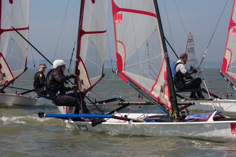 Musto Skiffs at Stokes Bay photo copyright Tim Olin / www.olinphoto.co.uk taken at  and featuring the Musto Skiff class