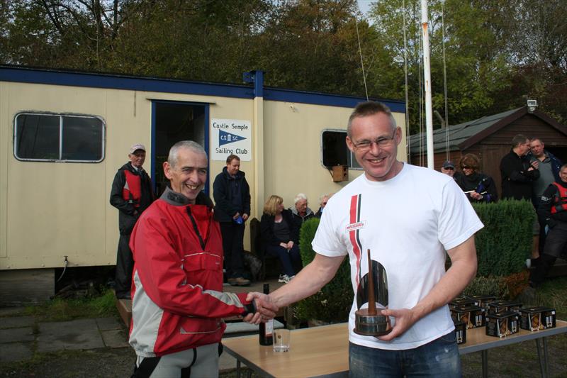 .....Angus Beyts presents Ed Willett with the Lairwell trophy for the winning the Scottish N12 Travellers series in 2014 - photo © Douglas Sommerville