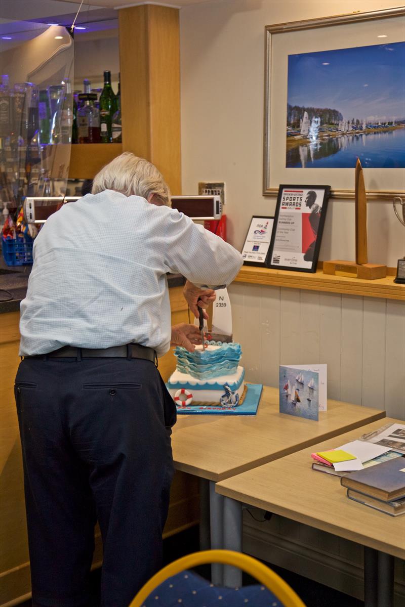Mike Jackson cuts the cake during the National 12 85th Anniversary Event at Northampton photo copyright Steve Le Grys taken at Northampton Sailing Club and featuring the National 12 class