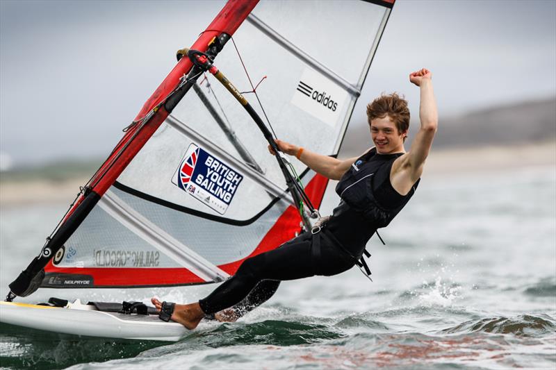 Andy Brown on day 5 of the RYA Youth National Championships photo copyright Paul Wyeth / RYA taken at Plas Heli Welsh National Sailing Academy and featuring the RS:X class
