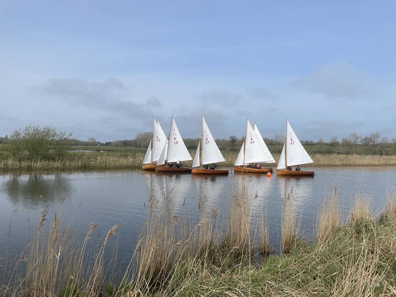 The fleet round the leeward mark during the Broads Area 2022 Champion-of-Champions Sailing Event photo copyright Ben Falat taken at Beccles Amateur Sailing Club and featuring the Norfolk 14 Foot One Design class