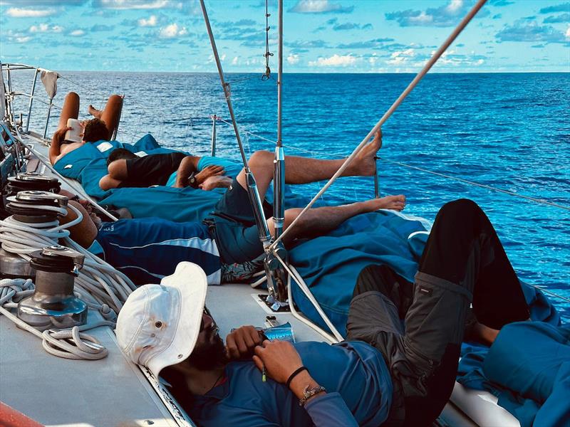 The Outlaw crew struggle with heat – with water temperatures in the 30's there is little respite anywhere photo copyright OGR2023 / Outlaw taken at  and featuring the Ocean Globe Race class