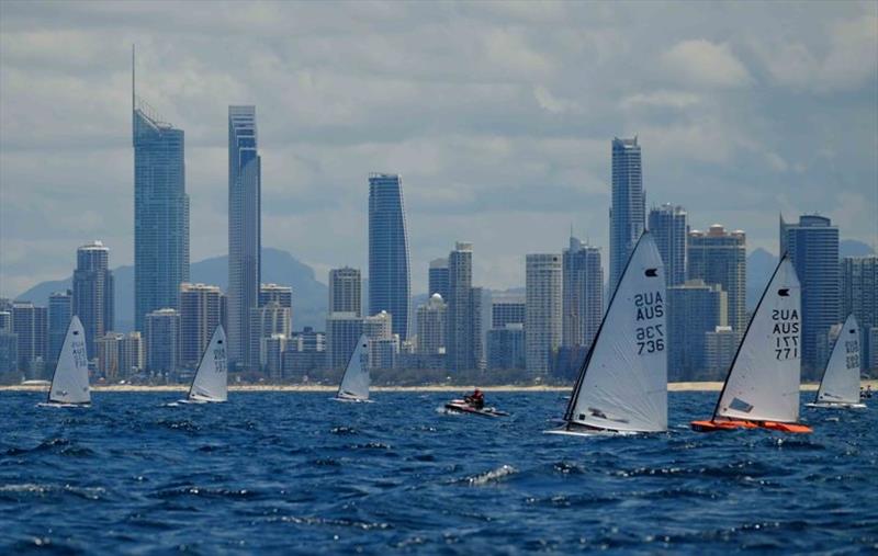Fleet sailing with the famous Gold Coast's Surfers Paradise skyline – International OK Dinghy National Championships photo copyright Southport Yacht Club taken at  and featuring the OK class