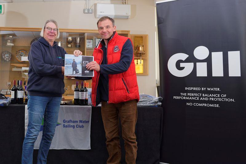 Vice-Commodore Hilary Talbot presents first prize to Krzysztof Bonicki winner of the single-handed handicap fleet in the Gill Summer Series at Grafham Water photo copyright Paul Sanwell / OPP taken at Grafham Water Sailing Club and featuring the OK class