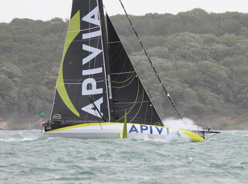 Apivia passes Hurst Castle after the Rolex Fastnet Race start photo copyright Mark Jardine taken at Royal Ocean Racing Club and featuring the IMOCA class