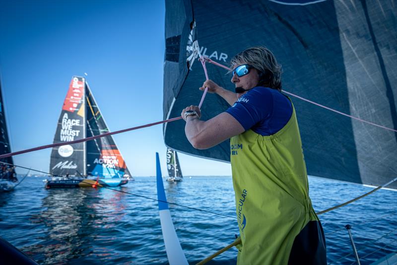 The Ocean Race 2022-23 - 8 June 2023, Leg 6 Start Day onboard Team Holcim - PRB. Abby Ehler assists the unfurl and trim of the J0 on the start line of Leg 6 photo copyright Georgia Schofield | polaRYSE / Holcim - PRB / The Ocean Race taken at  and featuring the IMOCA class