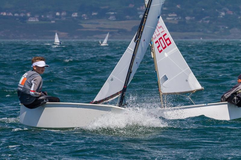 Harry Bell (IRL 1473) in the second race of the Optimist European Championships on Dublin Bay photo copyright Gareth Craig / www.fotosail.com taken at Royal St George Yacht Club and featuring the Optimist class