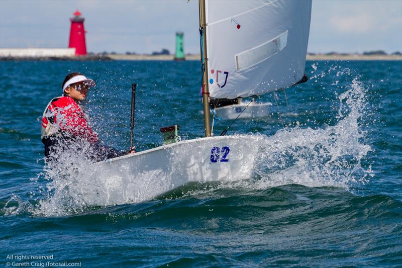 Marta Andronic (ROU 111) from Romania competing in the third day of the Optimist European Championships on Dublin Bay photo copyright Gareth Craig / www.fotosail.com taken at Royal St George Yacht Club and featuring the Optimist class