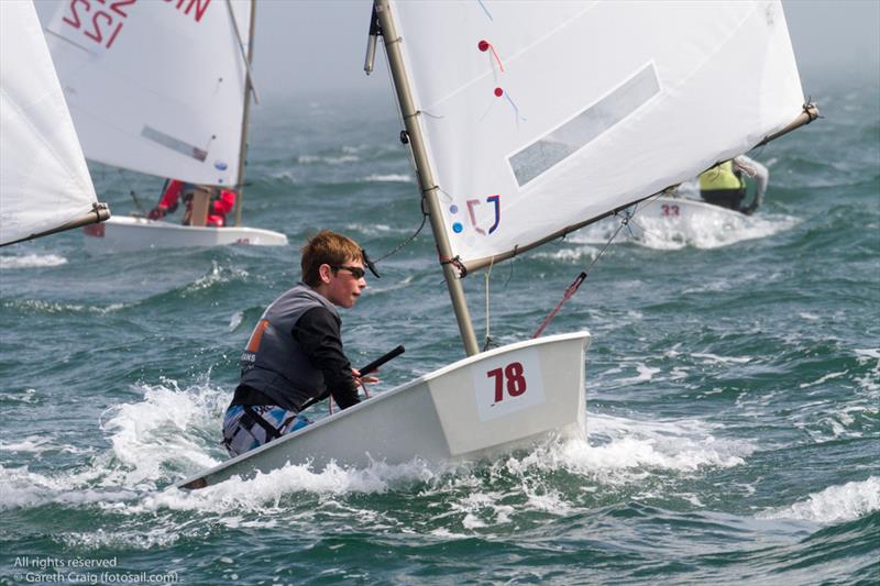James McCann (IRL 1502) on the fourth day of the Optimist European Championships on Dublin Bay photo copyright Gareth Craig / www.fotosail.com taken at Royal St George Yacht Club and featuring the Optimist class