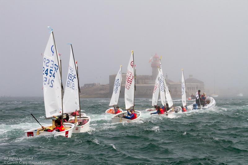 The Spanish coach boat towing their sailors back to shore on the fourth day of the Optimist European Championships on Dublin Bay photo copyright Gareth Craig / www.fotosail.com taken at Royal St George Yacht Club and featuring the Optimist class