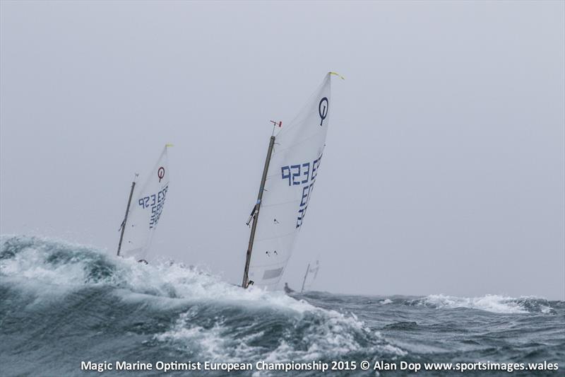 Disappearing sails in the Pwllheli waves during the Magic Marine Optimist Europeans photo copyright Alan Dop / www.sportsimages.wales taken at Plas Heli Welsh National Sailing Academy and featuring the Optimist class