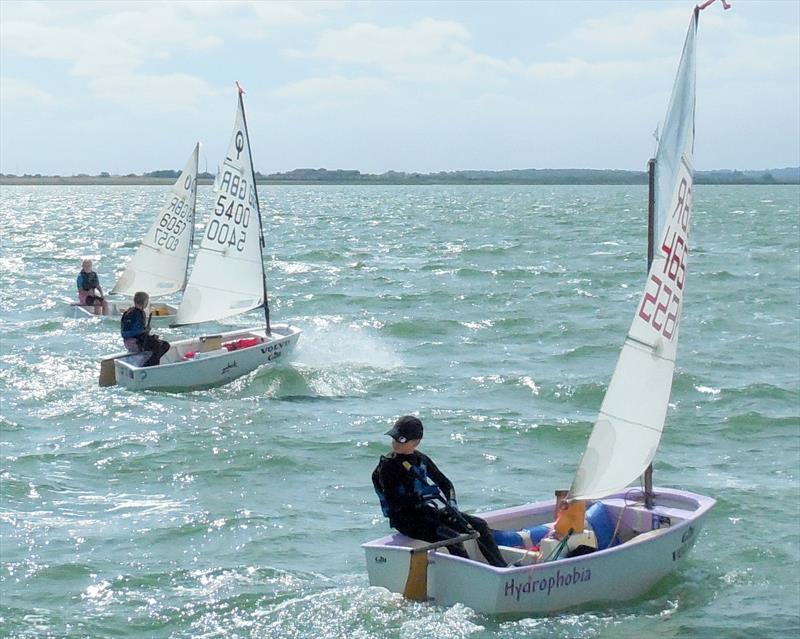 Regatta Fleet first start (L-R: Lucy Shelter, Isabelle Evans, Matthiew Bernard) in the Optimist open meeting at Blackwater Sailing Club photo copyright Chris Nicholls taken at Blackwater Sailing Club and featuring the Optimist class