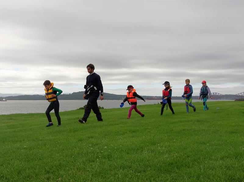 The Optimist sailors and Matt recreating the Beatles Abby Road Album Cover during the Dalgety Bay Development Regatta photo copyright Kiki Papapanagioutou taken at Dalgety Bay Sailing Club and featuring the Optimist class