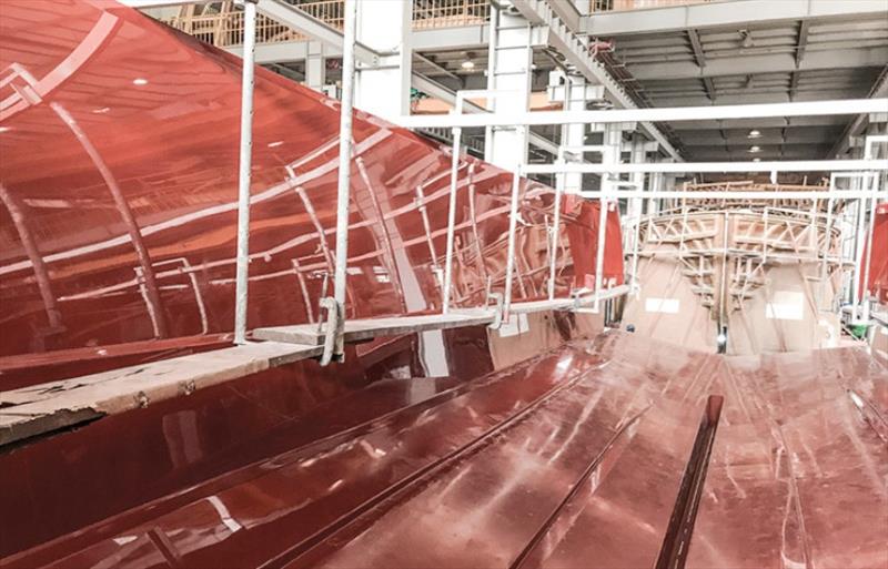 Final detailing of the moulded surface of the hull shell to ensure a perfect finish. - photo © Riviera Australia
