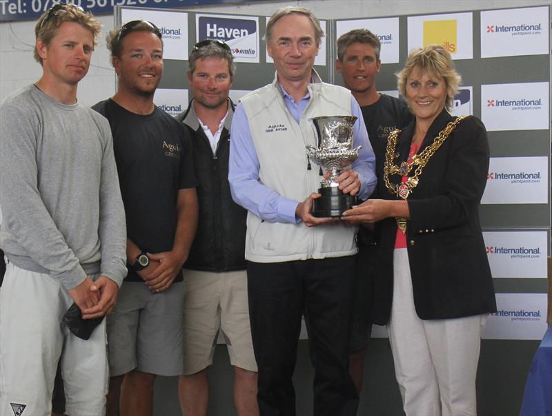 Sam Laidlaw's 'Aguila' team are presented with the Canford Cup by the Mayor of Poole Xena Dion at the International Paint Poole Regatta photo copyright Mark Jardine taken at  and featuring the Quarter Tonner class