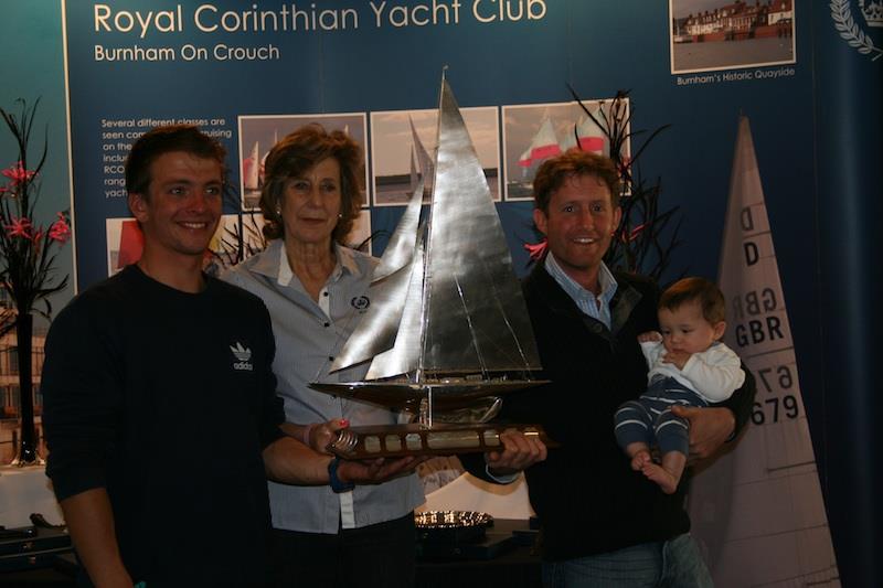Ben Saxton (left) and Toby Lewis receive the Endeavour Trophy from Annie Reid photo copyright Sue Pelling taken at Royal Corinthian Yacht Club, Burnham and featuring the RS200 class