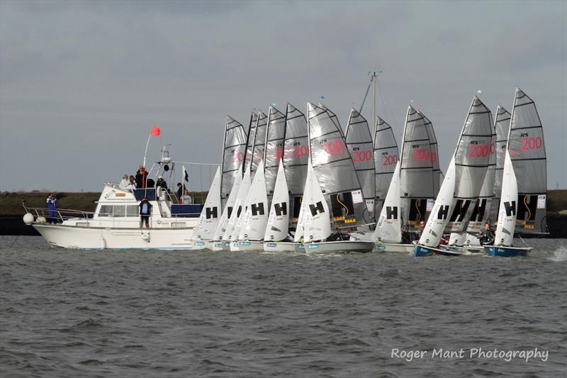 A crowded committee boat end of the start on day 1 of the 2017 Endeavour Trophy photo copyright Roger Mant Photography taken at Royal Corinthian Yacht Club, Burnham and featuring the RS200 class