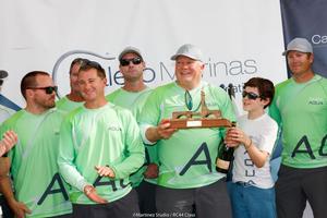 Team Aqua owner Chris Bake receives the trophy for third place at the RC44 Calero Marinas Cup photo copyright  Martinez Studio / RC44 Class taken at  and featuring the  class