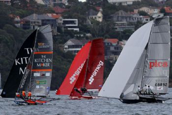 The UK's Pica with 2 local teams on the first spinnaker run in race 1 of the  64th JJ Giltinan Championship