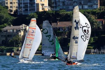 The Rag's spinnaker comes down as C-Tech and AppliancesOnline close in during race 3 of the 64th JJ Giltinan Championship