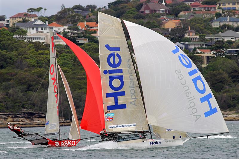 Haier Appliances grabs a narrow lead down the first run in the rescheduled race 1 of the 2014 JJ Giltinan Championship photo copyright Frank Quealey taken at Australian 18 Footers League and featuring the 18ft Skiff class