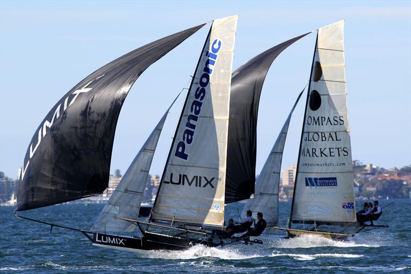 Lumix and Compassmarkets on the first spinnaker run during the Mick Scully Memorial Trophy photo copyright Frank Quealey taken at  and featuring the 18ft Skiff class