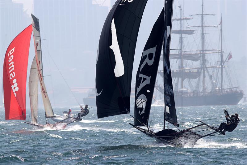 Coopers 62-Rag and Famish Hotel chases Smeg down the first spinnaker run during race 3 of the 18ft Skiff Club Championship photo copyright Frank Quealey taken at  and featuring the 18ft Skiff class
