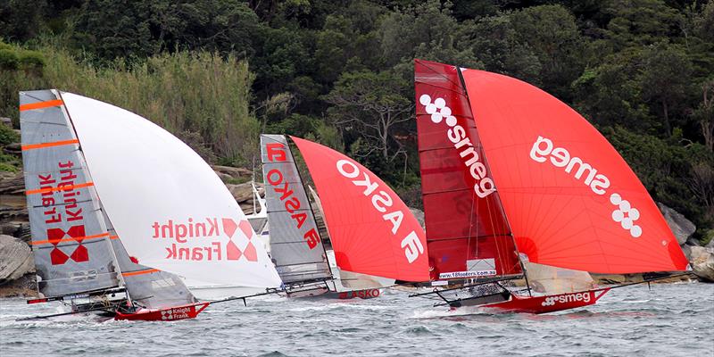 Seeing red on the run into Rose Bay during 18ft Skiff JJ Giltinan Trophy Race 1 photo copyright Frank Quealey taken at  and featuring the 18ft Skiff class
